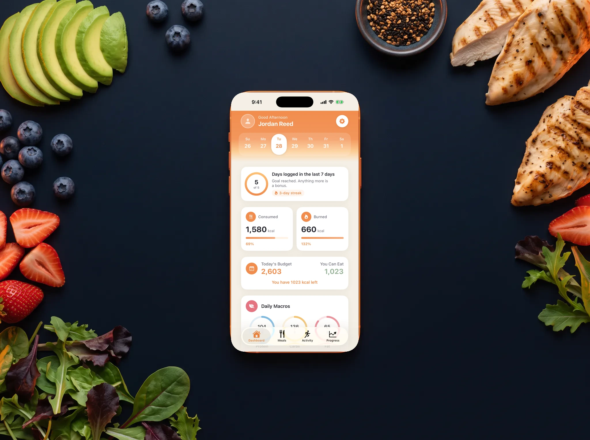 Nutrition tracking phone surrounded by healthy ingredients